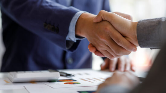 Financial Business handshake for teamwork of business merger and
